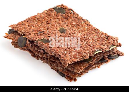 Stack of linseed and pumpkin raw crackers isolated on white. Stock Photo