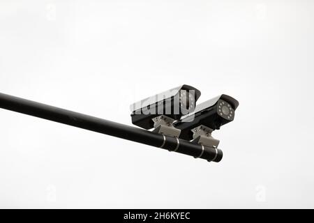 Security surveillance camera system attached on the traffic light pole Stock Photo