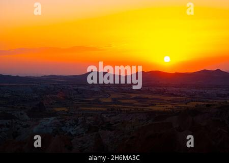 Sunset over the mountains. Sunset scene with silhouettes of mountains Stock Photo