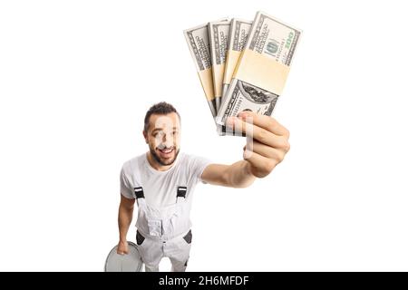 House painter holding money in front of camera isolated on white background Stock Photo