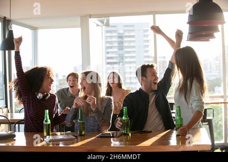 Excited business people celebrating in office Stock Photo