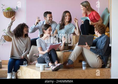 Smiling business people having a video call in office Stock Photo