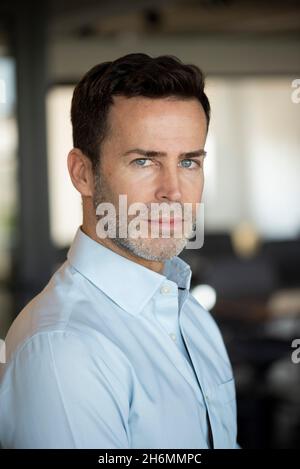Portrait of thoughtful businessman in office Stock Photo