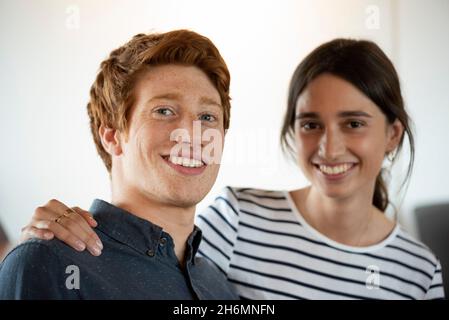 Portrait of smiling business people sitting in office Stock Photo