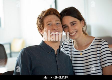 Portrait of smiling business people sitting in office Stock Photo