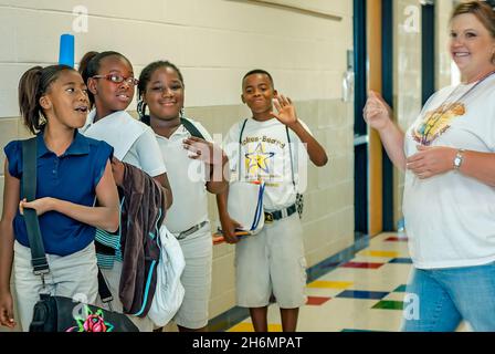 Elementary school students wave goodbye to their teachers as they line up for the bus on the last day of school, June 13, 2011, in Mississippi. Stock Photo