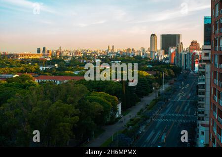 Elevated view of traffic driving on street with office buildings in city Stock Photo