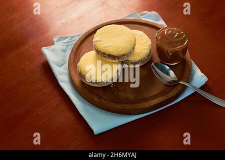 Alfajores Traditional Argentinean pastries made with cornstarch filled with caramel and coconut Stock Photo