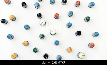 Amplifier mixer buttons in chaotic order on white background Stock Photo