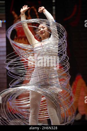 Cary, North Carolina, USA. 16th Nov, 2021. TIAN TIAN WANG performs a dance with hula hoops as hundreds turned out for a sneak preview of the fifth North Carolina Chinese Lantern Festival at the Koka Booth Amphitheatre in Cary, NC. Most of the lanterns at the festival are hand-made in China's lantern capital, the city of Zigong in Sichuan Province. Once they arrive in Cary, it takes three weeks to build the festival from the ground up. Chinese lanterns go back thousands of years and are thought to represent good fortune and prosperity. (Credit Image: © Bob Karp/ZUMA Press Wire) Stock Photo