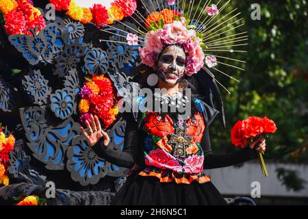 Mexico City, Mexico ; October 31 2021:  Day of the Dead, people in disguise during the Day of the Dead parade Stock Photo