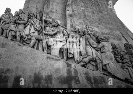 Statues of the great Portuguese explorers on the Monument to the Discoveries (Padrão dos Descobrimentos) in the city of Lisbon, Portugal. Black and wh Stock Photo