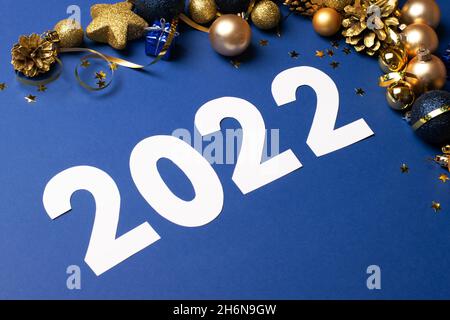 Festive composition layout mockup postcard for Christmas or New Year with numbers 2022. Stock Photo