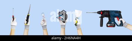 Gloved hands holding set construction tools spatula, goggles, drywall hacksaw, screwdriver, trowel, laser level, drill, perforator on blue Stock Photo