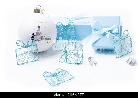 Christmas and newborn motifs on white snowy background Stock Photo