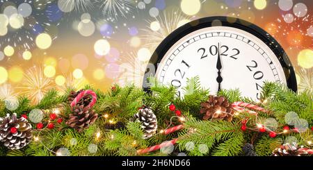 New Year clock 2022 and Christmas garland.