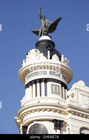 Statue of a Man on a phoenix on the Unión y el Fénix building in Plaza de las Tendillas by the architect Benjamín Gutiérrez Prieto in Cordoba Spain Stock Photo