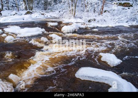 River with flowing water in the winter Stock Photo