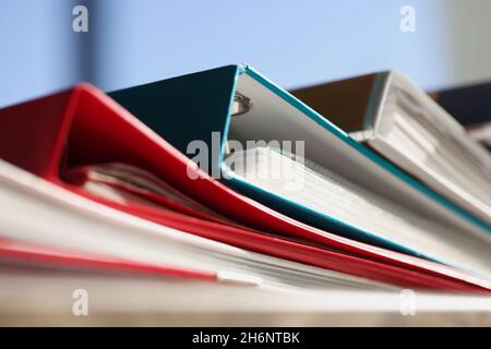 Stack of colourful folders for documents on table Stock Photo