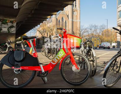 A Lime e-bike parked in Hammersmith, west London, England, U.K. Stock Photo