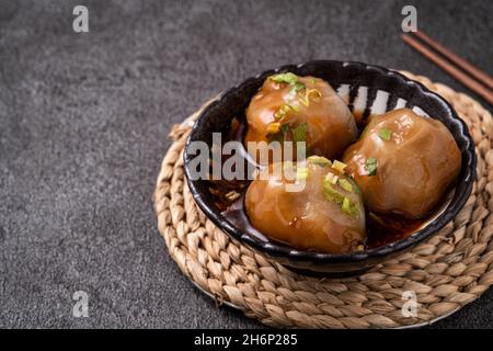 Close up of Bawan (Ba wan), Taiwanese meatball delicacy, delicious street food, steamed starch wrapped round shaped dumpling with pork and shrimp insi Stock Photo