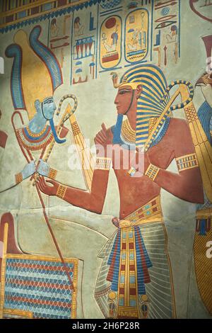 Ancient Egyptian painted wall relief from the tomb of Sety I, 1290-1279 BC, 19th dynasty, Valley of the Kings Kuxor. Plaster cast.  The panel depicts Stock Photo