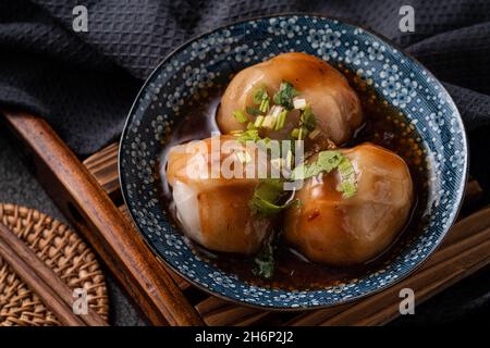 Close up of Bawan (Ba wan), Taiwanese meatball delicacy, delicious street food, steamed starch wrapped round shaped dumpling with pork and shrimp insi Stock Photo