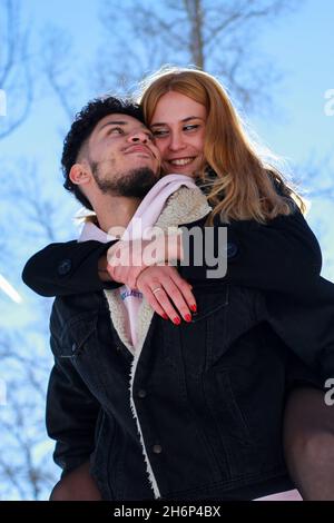 Vertical image of a young engaged couple where Stock Photo