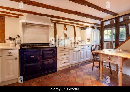 Stoke By Clare, England October 17 2019: Kitchen interior inside traditional english cottage with exposed brickwork and beams, built in cuboards and o Stock Photo