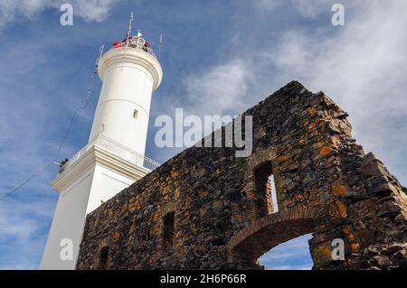 Colonia del Sacramento lighthouse and part of the old stone constructions next to it Stock Photo