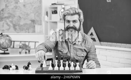 man studying the next chess move Stock Photo - Alamy