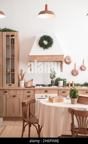 Festive christmas modern kitchen with big tree Stock Photo