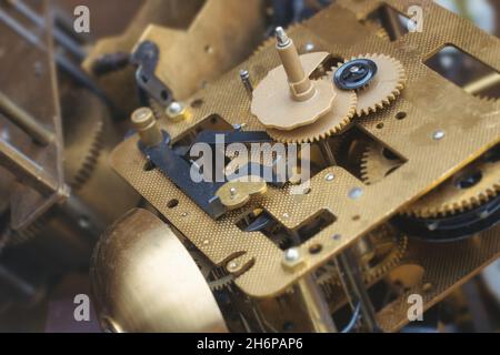 Rustic gear clock mechanism, close-up of old clock mechanism with gears. selective focus. Stock Photo