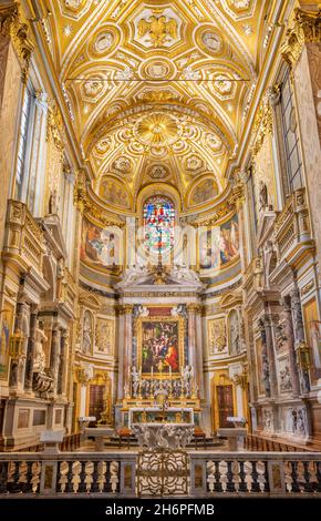 ROME, ITALY - SEPTEMBER 1, 2021: The presbytery of church Santa Maria dell Anima with the altarpiece depicts The Holy Family and Saints by Giulio Roma Stock Photo