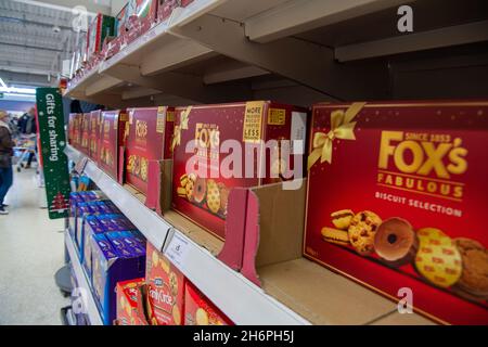 Taplow, Buckinghamshire, UK. 17th November, 2021. Christmas biscuit selection boxes for sale. Sainsbury's Supermarket was well stocked with Christmas food and drink today. Previous supply chain issues in the food and drink market in England post Brexit appear to be easing with no obvious panic buying. Credit: Maureen McLean/Alamy Stock Photo