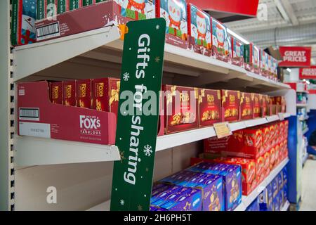 Taplow, Buckinghamshire, UK. 17th November, 2021. Christmas biscuit selection boxes for sale. Sainsbury's Supermarket was well stocked with Christmas food and drink today. Previous supply chain issues in the food and drink market in England post Brexit appear to be easing with no obvious panic buying. Credit: Maureen McLean/Alamy Stock Photo