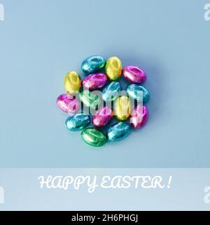 Easter greeting card with traditional colorful chocolate easter eggs Stock Photo