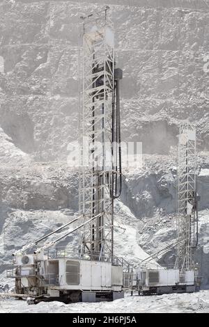 Blasthole drill in an open pit copper mine operation in Chile Stock Photo