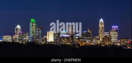 Panoramic view of the colorful skyline of downtown Charlotte, North Carolina, at dusk. Stock Photo