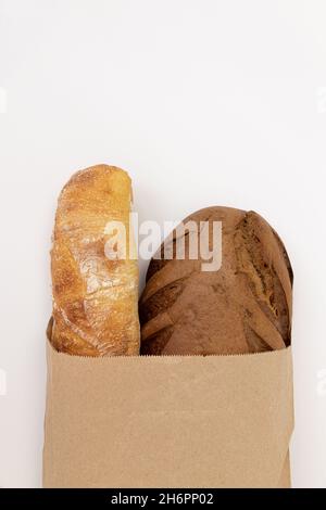 Paper bag with different kind of bread isolated on white Stock Photo ...