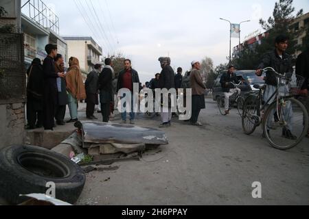 Kabul, Afghanistan. 17th Nov, 2021. People gather at the site of an explosion in Kabul, Afghanistan, Nov. 17, 2021. At least one civilian was killed and six others were wounded in twin explosions in western part of Kabul, capital of Afghanistan on Wednesday, an official confirmed. Credit: Kabir/Xinhua/Alamy Live News Stock Photo