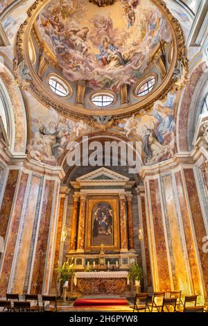 ROME, ITALY - SEPTEMBER 2, 2021: The side chapel with fresco Glory of St. Catherine of Siena and painting Madonna of Rosary Stock Photo