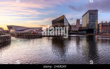 Early evening with the dramatic, funky, new, buildings at Liverpool One reflected in Canning Dock at Liverpool's historic Albert Dock. Stock Photo