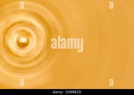 Abstract spinning gold circles texture background. Stock Photo