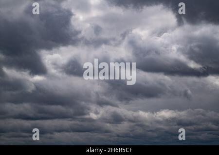 dark storm clouds in the evening spring sky Stock Photo