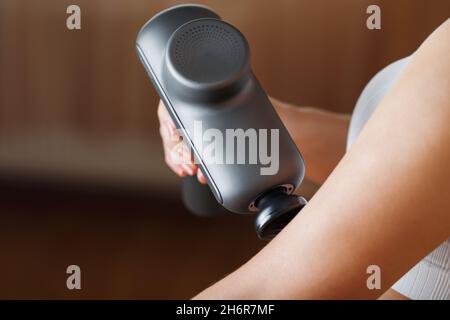 Massage of women's legs with a shock massage device. Shock self-massage to  restore fascia muscles and trigger points Stock Photo - Alamy