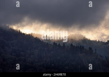 Evening storm, Great Smoky Mountain National Park - Sevier County, Tennessee. Late sun lights up an autumn storm moving through the mountain tops. Stock Photo
