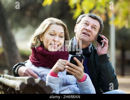 Couple with mobile phones Stock Photo