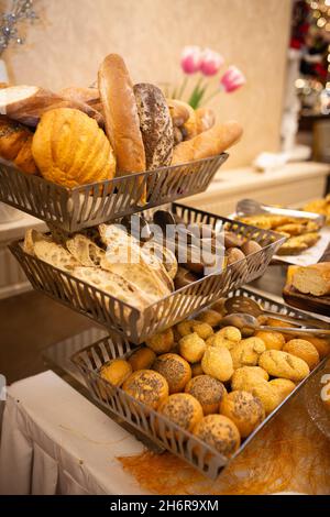 assorted bread basket on the buffet table. Stock Photo