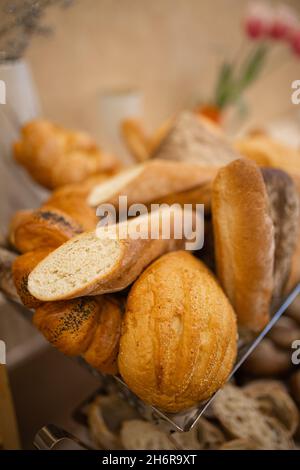 assorted bread basket on the buffet table. Stock Photo